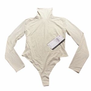 Lululemon Wundermost Ultra-Soft Nulu Turtleneck Bodysuit (Bone) Size: Small
